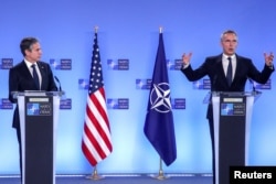 U.S. Secretary of State Antony Blinken, left, and NATO Secretary General Jens Stoltenberg attend a news conference at a NATO Foreign Ministers' meeting at the Alliance's headquarters in Brussels, Belgium, March 23, 2021.