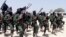 FILE - Hundreds of newly trained al-Shabab fighters perform military exercises in the Lafofe area 18 km south of Mogadishu, Somalia, Feb. 17, 2017. Tuesday's U.S. drone strike reportedly targeted an al-Shabab training camp in Somalia's Bay region.