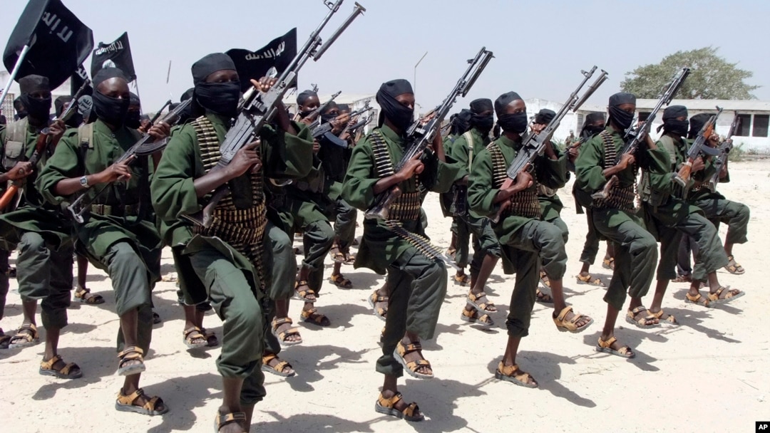 FILE - Hundreds of newly trained al-Shabab fighters perform military exercises in the Lafofe area 18 km south of Mogadishu, Somalia, Feb. 17, 2017. 