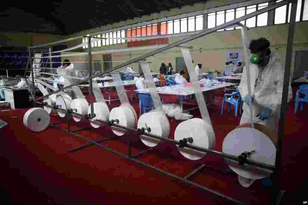 Workers make protective face masks at a factory in Kabul, Afghanistan.