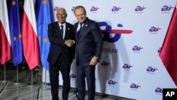 Poland's Prime Minister, Donald Tusk, right, welcomes EU Council President Antonio Costa to a gala event celebrating Poland's assumption of the EU Presidency, in Warsaw, Poland, Jan. 3, 2025.