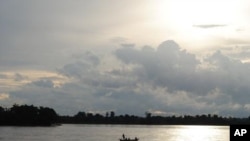 A fishing boat floats on the Mekong river at Sambor in Cambodia's Kratie Provice, another site in the country that has been chosen for a proposed 18-kilometer hydro-dam.