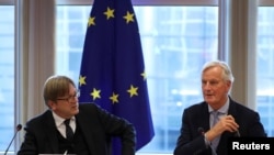 European Union's Chief Brexit Negotiator Michel Barnier and Guy Verhofstadt, European Parliament’s Brexit steering group coordinator, attend a meeting with the Brexit steering group at the European Parliament in Brussels, Oct. 2, 2019. 