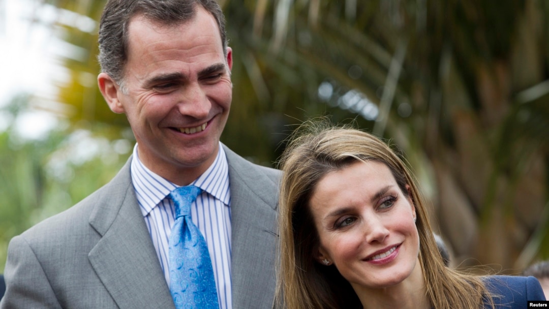 FILE - Spain's Crown Prince Felipe and Princess Letizia smile as they attend the inauguration of the "Palmetum" botanic park in Santa Cruz de Tenerife, on the Spanish Canary Island of Tenerife, Jan. 28, 2014. 