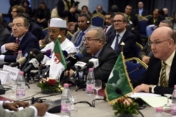 FILE - Algerian Foreign Minister Ramtane Lamamra (C) speaking during a meeting for a peace agreement between the Malian government and some northern armed groups on Jan. 18, 2016, in the Algerian capital, Algiers.