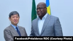 Président Félix Tshisekdi akutani na président ya JACI (Agence ya boyokoni ya Japon no molongo), Sinichi Kitaoka na cité ya Union africaine na Kinshasa, 15 juillet 2019. (Facebook/Présidence RDC)