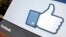 FILE - The Facebook "Like" icon displayed outside of company headquarters, Menlo Park, California, Jan. 2012.