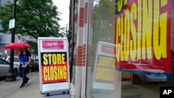 FILE - Sept. 2, 2020, a business storefront with store closing signs in Boston as Hiring is slowing and many Americans have given up looking for work, the government said Friday, Oct. 2, in the final jobs report.