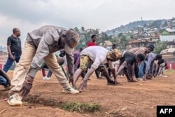 After registering to fight alongside the Armed Forces of the Democratic Republic of Congo against M23 rebels, volunteers exercise at Funu Stadium in Bukavu, Congo, Jan. 31, 2025.