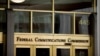 FILE - The entrance to the Federal Communications Commission (FCC) building is seen in Washington, June 19, 2015.