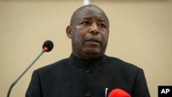 Burundi's President Evariste Ndayishimiye speaks to the media after signing the book of condolences at the presidential palace in Bujumbura, Burundi, June 13, 2020.