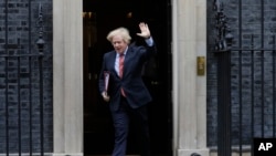 Britain's Prime Minister Boris Johnson leaves 10 Downing Street to attend the weekly session of PMQs in Parliament in London, June 10, 2020.