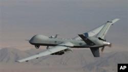 A Reaper drone armed with Hellfire missiles patrols the skies in southern Afghanistan near the frontier with Pakistan.