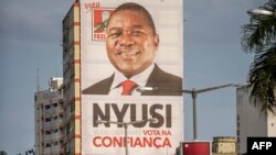 A giant Mozambican Liberation Front (FRELIMO) billboard hangs from a building in Avenida Edoardo Modlande on the eve of Mozambican Presidential and Legislative elections on October 14, 2014 in Maputo.