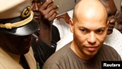 Karim Wade (droite), Dakar, 26 février 2012