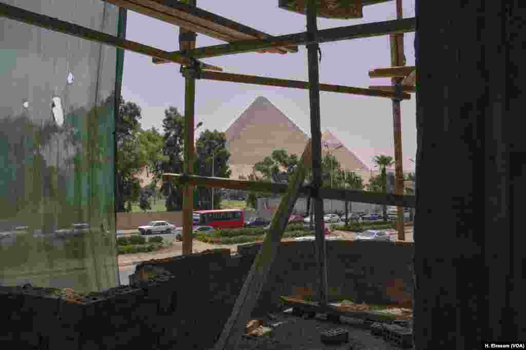 A view of pyramids at Giza from a building under construction. Urban sprawl in Egypt is threatening not only agricultural land but also the country&rsquo;s cultural heritage. And yet, government figures show the majority of Egypt&rsquo;s population lives on 6 percent of the land.