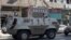 FILE - Army soldiers stand guard in their military vehicle in central Cairo, August 30, 2014.