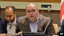 FILE - Washington Post reporter Jason Rezaian participates in a panel discussion on media freedom at United Nations headquarters, in New York, Sept. 25, 2019. 