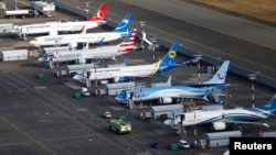 FILE - An aerial photo shows several Boeing 737 MAX airplanes grounded at Boeing Field in Seattle, Washington, March 21, 2019. 