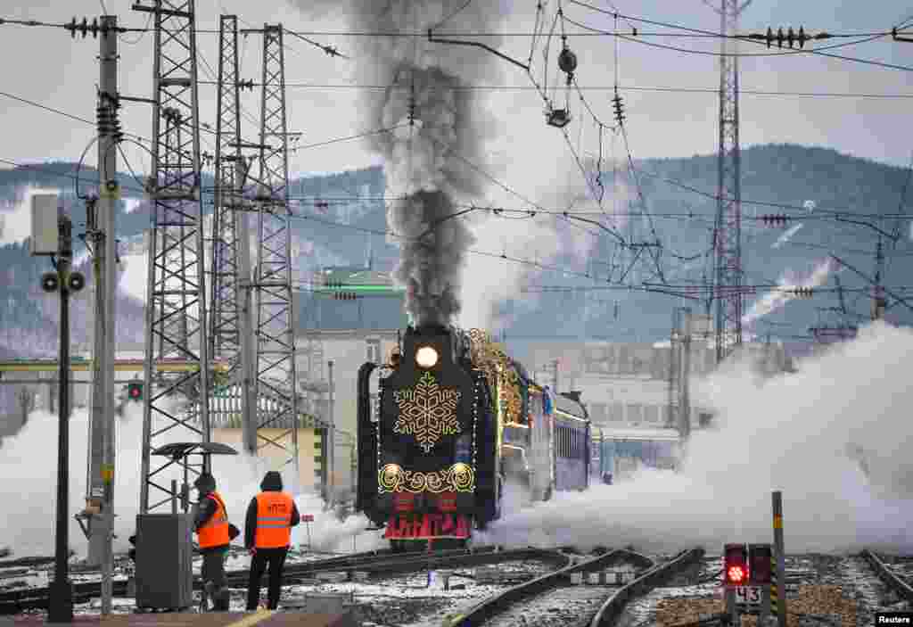 A steam train of Ded Moroz (Father Frost) - the Russian equivalent of Santa Claus, travelling all over the country ahead of the New Year and Christmas season, moves along a railway in the Siberian city of Krasnoyarsk, Russia.