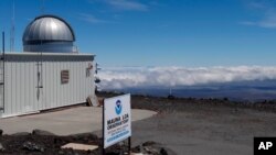 This 2019 photo provided by NOAA shows the Mauna Loa Atmospheric Baseline Observatory, high atop Hawaii's largest mountain in order to sample well-mixed background air free of local pollution.