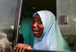 A rescued JSS Jangebe schoolgirl reacts after arriving in Jangebe, Zamfara, Nigeria, March 3, 2021. More than 270 schoolgirls kidnapped in northwestern Zamfara state were freed by their captors.
