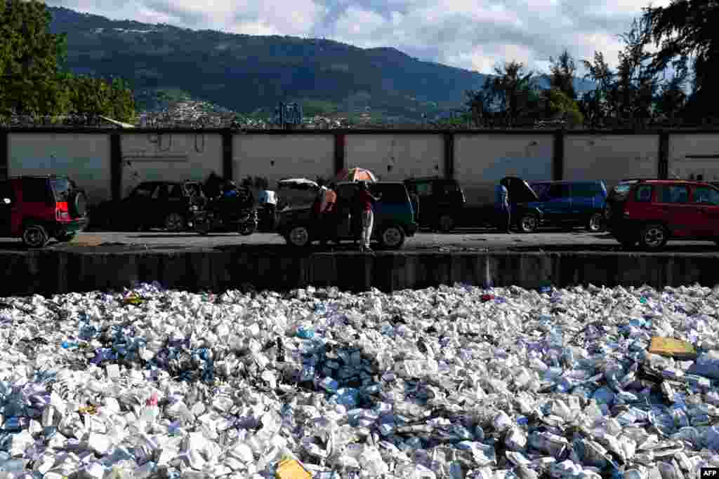 Plastic waste is seen floating on a sewage canal in the Haitian capital Port-au-Prince, April 23, 2019.