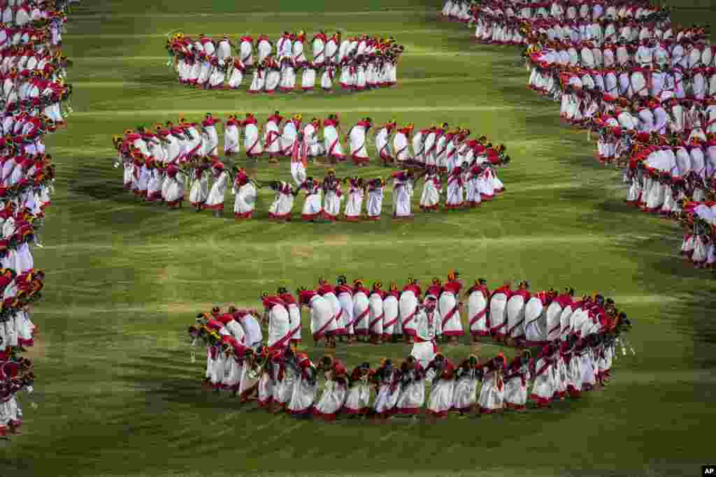 Tribal youth perform Jhumur dance during a dance event attempting a world record in Guwahati, India.