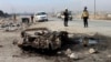 Syrian White Helmet civil defense workers inspect the area of a car bomb attack that killed least 15 people and wounded dozens, the local Syrian civil defense reported, near Manbij, Syria, Feb. 3, 2025. (Syrian Civil Defense White Helmets via AP)