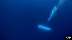 This undated image courtesy of OceanGate Expeditions, shows their Titan submersible during a descent.