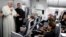Pope Francis talks to journalists during a press conference aboard a plane to Rome at the end of his visit to Colombia, Sept. 11, 2017.