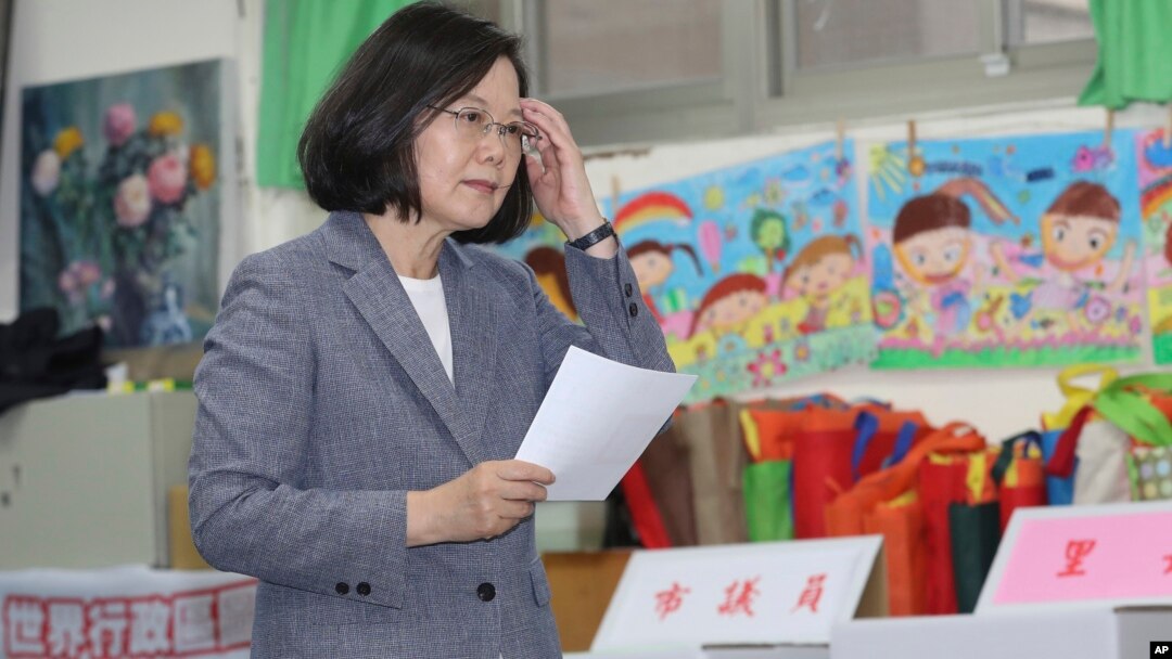 Taiwanese President Tsai Ing-wen waits to cast her ballot, Nov. 24, 2018, in Taipei, Taiwan. Taiwanese began voting in midterm local elections Saturday seen as a referendum on Tsai's independence-leaning administration, amid growing pressure from China.