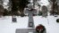 FILE - A wreath adorns a headstone for Michael Karkoc at Hillside Cemetery in Minneapolis, Jan. 21, 2020. 