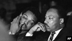 FILE -Dr. Martin Luther King, Jr. is seen here with Rev. Jesse Jackson (L) just prior to his final public appearance to address striking Memphis sanitation workers on April 4, 1968. 