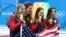 Tim perenang putri Amerika Serikat, dari kiri ke kanan, Katie Ledecky, Allison Schmitt, Leah Smith dan Maya DiRado, memegang medali emas mereka setelah memenangkan nomor estafet putri 4x200 meter dalam Olimpiade 2016 di Rio de Janeiro (11/8). (AP/Lee Jin-man)