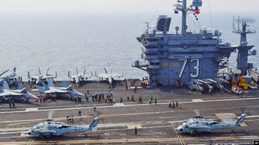 South Korean Sea Hawk helicopters land aboard the aircraft carrier USS George Washington during joint South Korean, U.S. military exercises, 27 July 2010