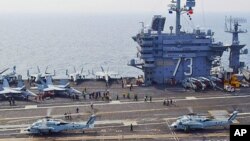 South Korean Sea Hawk helicopters land aboard the aircraft carrier USS George Washington during joint South Korean, U.S. military exercises, 27 July 2010