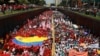Simpatizantes del gobierno de Venezuela participan en la marcha por el Día Internacional de los Trabajadores, en Caracas, el miércoles 1 de mayo de 2024. 