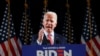 FILE - Democratic presidential candidate former Vice President Joe Biden poses for photos at a primary night election rally in Columbia, S.C., Feb. 29, 2020.