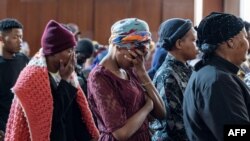 Survivors of a fire which gutted through a five story building and killed over 74 people in Johannesburg attend a memorial service at the Central Methodist Church in Johannesburg on September 8, 2023.