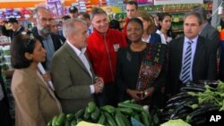 Valerie Amos, Under-Secretary-General and Emergency Relief Coordinator of the UN Office for the Coordination of Humanitarian Affairs, OCHA, second right, visiting a Syrian refugee camp near the Turkish-Syrian border, Turkey, March 13, 2013. 