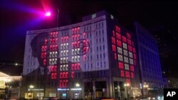 A special "Shinning A Lights" presentation honors Martin Luther King Jr. is seen on the side of the Indianapolis Power & Light Company downtown headquarters, Friday, Jan. 15, 2021, in Indianapolis. Guests can hear part of the I Have a Dream speech…