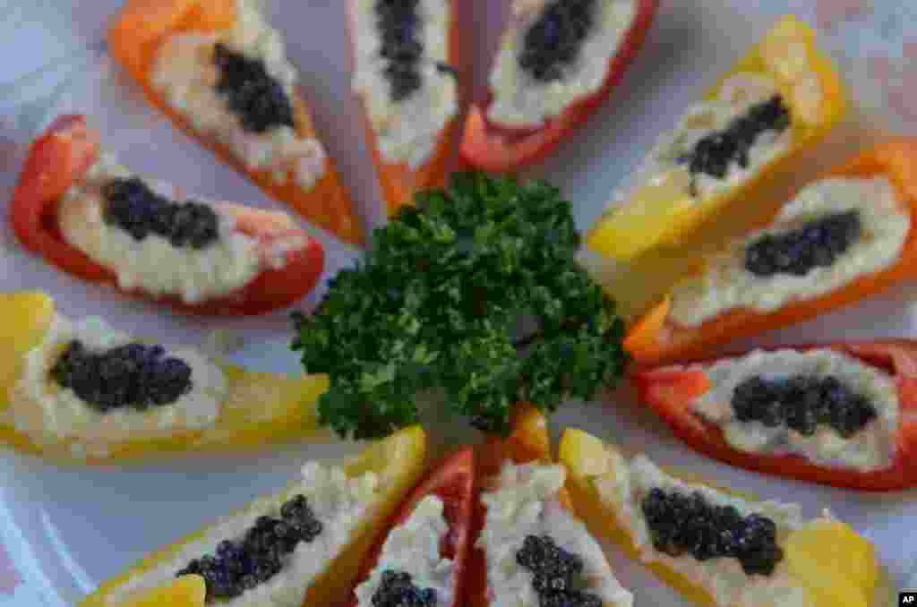 Caviar, coming from the unfertilized roe of sturgeon, are a delicacy. (VOA - S. Herman)