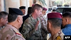 U.S. Major General Joel Vowell leaves after meeting with the Iraqi prime minister and top-ranking officials of the Iraqi armed forces and of the U.S.-led coalition during the first round of talks on the future of U.S. and other foreign troops in Iraq, in Baghdad, Jan. 27, 2024. 
