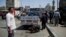 Security personnel use a bomb-sniffing dog at the scene of an explosion that killed at least one person on a bridge over the Nile River, near an upscale neighborhood of Cairo, Egypt, April 5, 2015.  