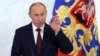 Putin Pledges to Boost Economy, Military