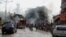 Firefighters work at one explosion site in Reyhanli, near Turkey's border with Syria, May 11, 2013.