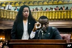 FILE—City Council member Alexa Aviles, left, walks over from her seat to comfort fellow member Yusef Salaam, right, as he becomes emotional during his address to the council, January 30, 2024, in New York.