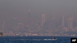 FILE - A thick blanket of smoke hangs over parts of Sydney, Sept. 14, 2023. On Sept. 19, 2023, Sydney experienced its first total fire ban in almost three years and several schools on the New South Wales state South Coast were closed because of a heightened wildfire danger 