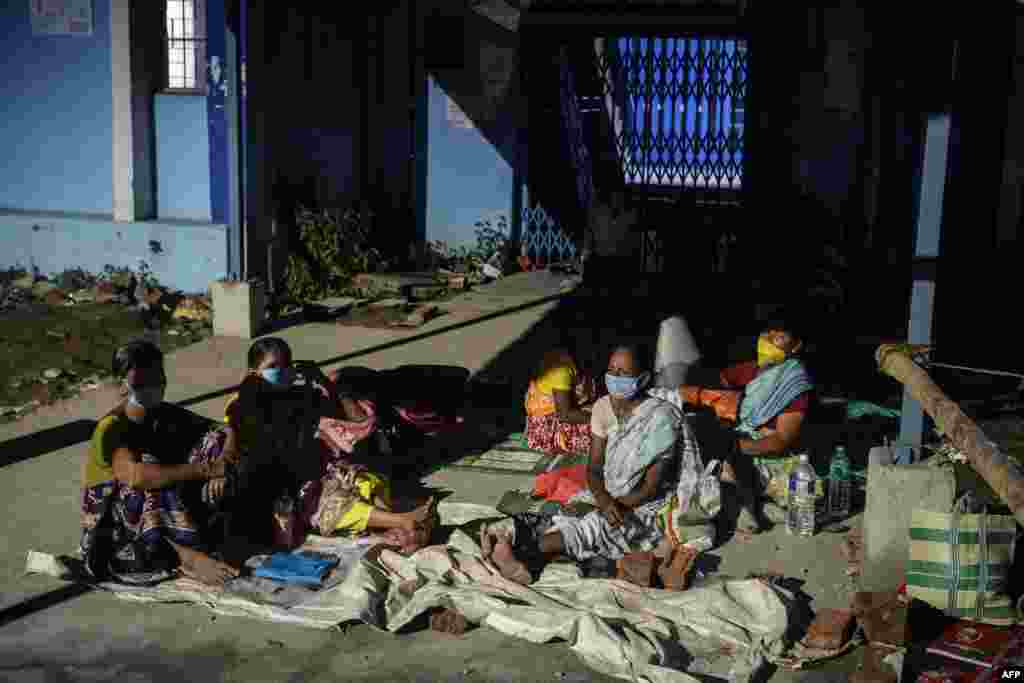 People wait for a Covid-19 coronavirus vaccine at the North Bengal Medical college and hospital on the outskirts of Siliguri, India.